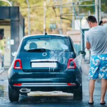 WaterJetWash guy cleans car