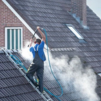 WaterJetWash guy cleans roof